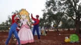 SYRIA/ Children play after volunteers from Syria's Violet Org charity's psychological support unit organised games during Eid al-Fitr celebrations for displaced children at a camp in the village of Killi in the Syrian rebel-held northwestern city of Idlib