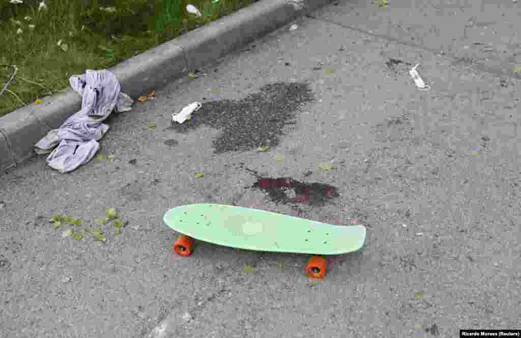 A child&#39;s skateboard sits next to blood stains on the pavement in Maksim Gorky Central Park after shelling in central Kharkiv on May 3. Ukraine&#39;s second-largest city has endured fierce Russian attacks, particularly on civilian areas, since the beginning of the war.