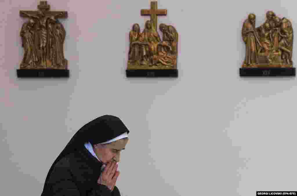 A Catholic nun prays during a Mass for peace in Ukraine, in Skopje, North Macedonia, on May 1.&nbsp;