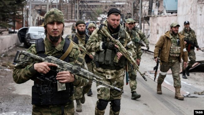 Men from Chechnya's Akhmat Volunteer Battalion patrol the Mariupol Iron and Steelworks after its capture from the Ukrainian Army.