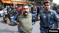 Armenia - Police arrest an opposition protester in Yerevan, May 3, 2022.