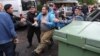 Police detain opposition protesters in Yerevan on May 2.