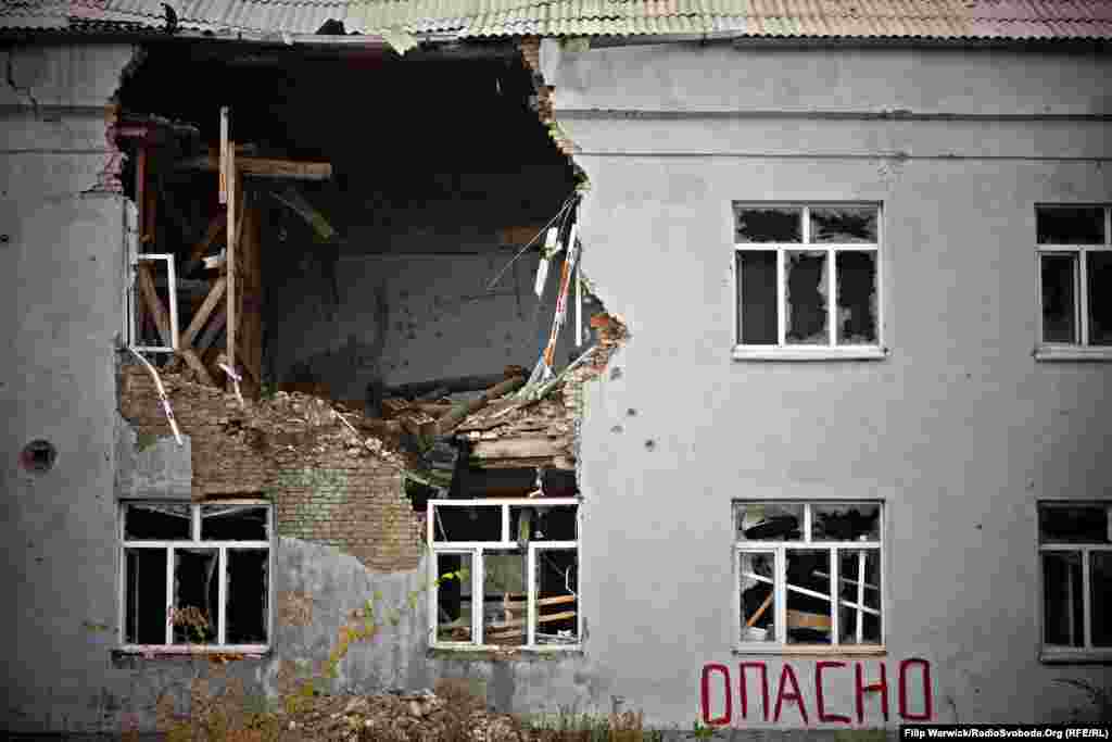 In eastern Ukraine&#39;s Luhansk region damaged homes are a common sight. The word &#39;dangerous&#39; is painted on this building to warn people the structure is unstable. &nbsp;