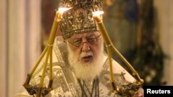 Georgian Patriarch Ilia II leads a midnight Christmas service at the Holy Trinity Cathedral in Tbilisi in January 2013.