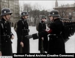 A colorized image from 1938 showing a swastika armband that was commonly worn by high-ranking Nazis.