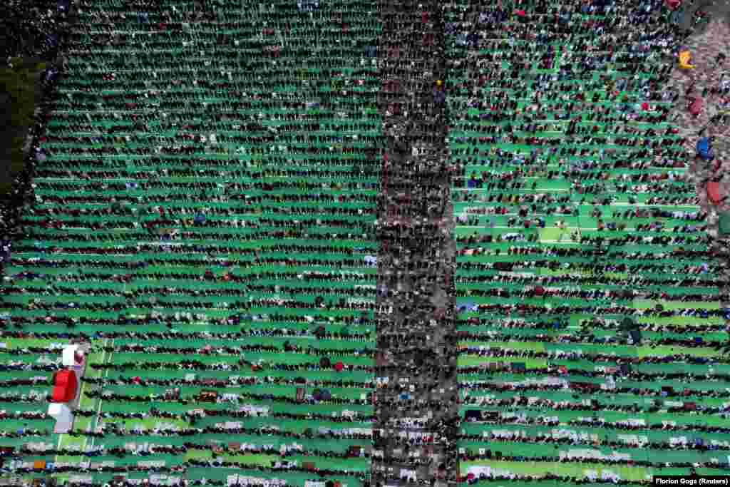 An aerial view shows Albanian Muslims saying morning prayers on the first day of Eid al-Fitr on Skanderbeg Square in Tirana on May 2.&nbsp;&nbsp;