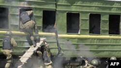 Russian troops board a train during a training exercise.