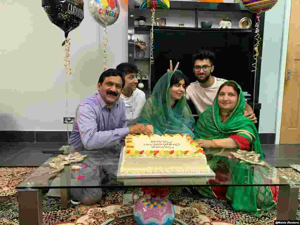 Yousafzai celebrates graduating from Oxford University with her family at an undisclosed location on June 18, 2020.