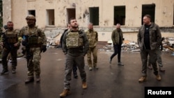 Ukrainian President Volodymyr Zelenskiy meets with soldiers and local officials in Kharkiv on May 29.