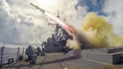 A US guided missile destroyer of the type shown above fired on an Iranian-flagged cargo ship seeking to evade a blockade (file photo).