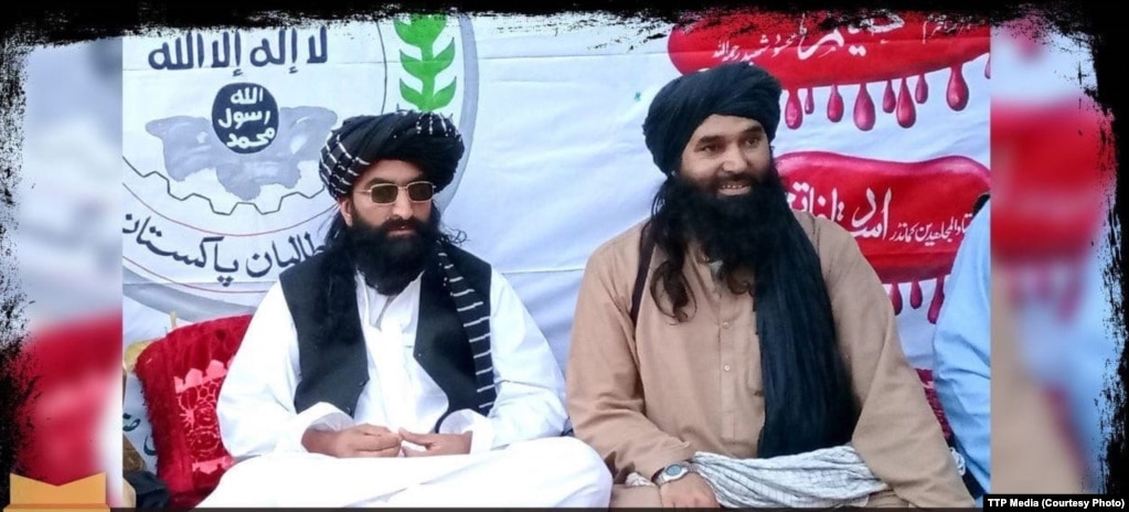 Tehrek-e Taliban Pakistan chief Noor Wali Mehsud (left) appears with another group leader in an undated photo.