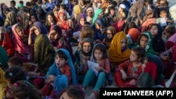 Afghan children attend a mobile school in Kandahar on June 5 in an initiative by volunteers wherein a vehicle travels from village to village conducting classes. 