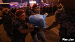 Armenia - Riot police arrest an opposition supporter in Yerevan, June 3, 2022.