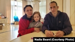 Nina and Yevhen Muravchenko with their daughter