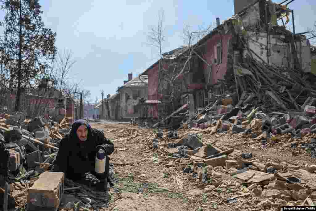 A local man in one of the devastated streets of Mariupol on April 7.&nbsp;