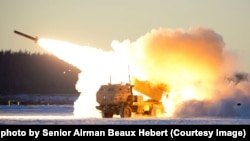 A U.S. Army M142 High Mobility Artillery Rocket Systems (HIMARS) launches ordnance
