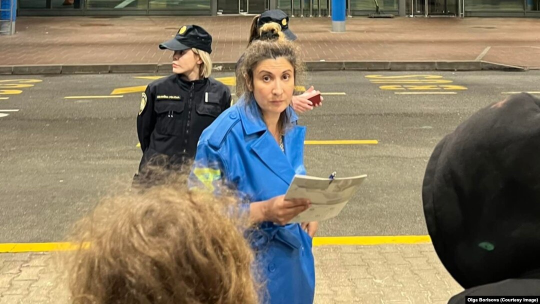 Olga Borisova, a member of Pussy Riot, posted this photo on May 31 of Aisoltan Niyazova (center) being arrested as the group entered Croatia from neighboring Slovenia.