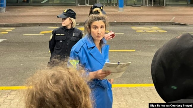 Olga Borisova, a member of Pussy Riot, posted this photo on May 31 of Aisoltan Niyazova (center) being arrested as the group entered Croatia from neighboring Slovenia.