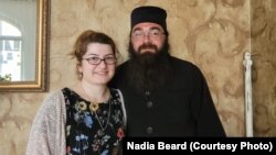 Father Isidore, a 35-year-old local Georgian Orthodox priest, with his wife, Irma