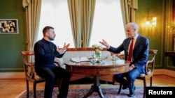 Ukrainian President Volodymyr Zelenskyy (left) meets Norwegian Prime Minister Jonas Store at the Prime Minister's residence in Oslo, Norway, March 20, 2025.