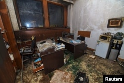 A damaged room inside the building housing the mayor's office after it was stormed by demonstrators in Almaty on January 5.