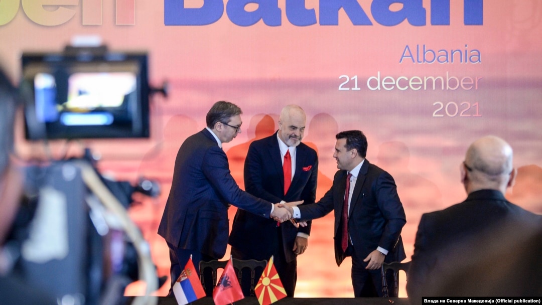 Serbia's Aleksandar Vucic (left to right), Albania's Edi Rama, North Macedonia's Zoran Zaev shake hands at the summit in Tirana on December 21.