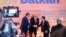 Serbia's Aleksandar Vucic (left to right), Albania's Edi Rama, North Macedonia's Zoran Zaev shake hands at the summit in Tirana on December 21.