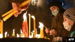 Worshipers light candles in a cathedral in the Armenian capital, Yerevan, on January 6, the day on which the country's main Christian church celebrates Christmas. (file photo)