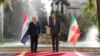 حسین امیرعبداللهیان (راست) وزیر خارجه ایران در مراسم استقبال از فواد حسین، همتای عراقی‌اش