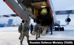 Russian airborne troops bound for Kazakhstan board a transport plane at Chkalovsky Airfield, northeast of Moscow, on January 6.