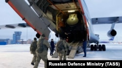 Russian troops board a plane before deploying to Kazakhstan, January 6, 2022.