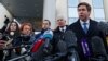 Ilya Novikov speaks to the media outside the Moscow City Court building after a hearing to consider the closure of the Memorial human rights center in December 2021. 