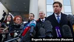 Ilya Novikov speaks to the media outside the Moscow City Court building after a hearing to consider the closure of the Memorial human rights center in December 2021. 