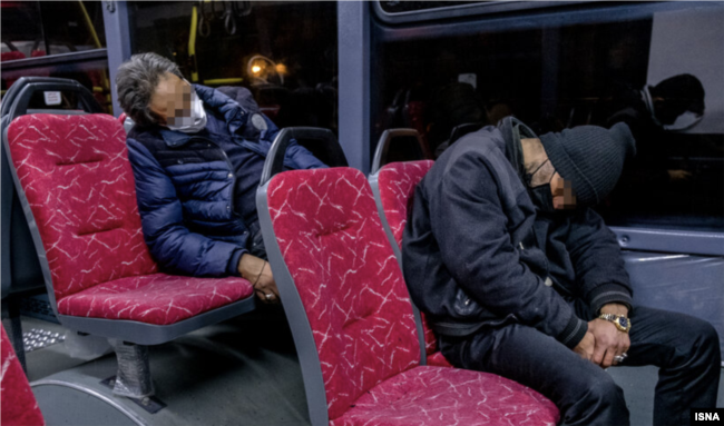 Cheaper than an apartment: two homeless Iranian men find refuge on public transport in Tehran.