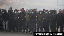 Demonstrators take part in a protest triggered by fuel price increase in Almaty, January 5, 2022.