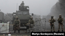 Troops are seen in Almaty's main square where hundreds of people were protesting against the government after the Kazakh authorities' decision to lift price caps on liquefied petroleum gas.