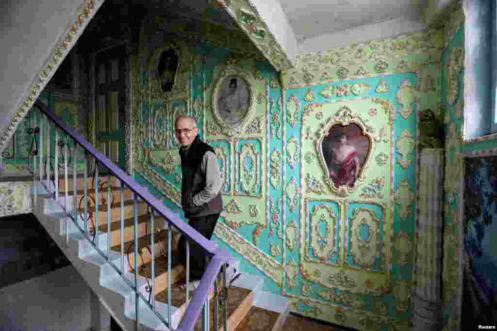 A stairwell is seen in an apartment block that one of its residents, 65-year-old Volodymyr Chayka, has spent the last five years decorating by himself in an elaborate, old-fashioned style, in a residential district of Kyiv. (Reuters/Gleb Garanich)