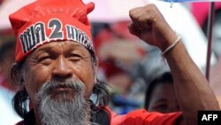 The protesters, supporters of ousted former Premier Thaksin Shinawatra, are occupying a makeshift village in downtown Bangkok.