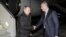 Russian President Vladimir Putin (left) shakes hands with Sergei Aksyonov, the de facto prime minister of the annexed Ukrainian peninsula, upon the former's arrival at Simferopol airport on December 2. 