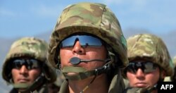 Kazakh soldiers stand to attention during joint military exercises within the framework of the Shanghai Cooperation Organization in Kyrgyzstan. (file photo)