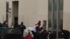 Firefighters and police officers gather in front of the offices of the French satirical newspaper Charlie Hebdo in Paris.