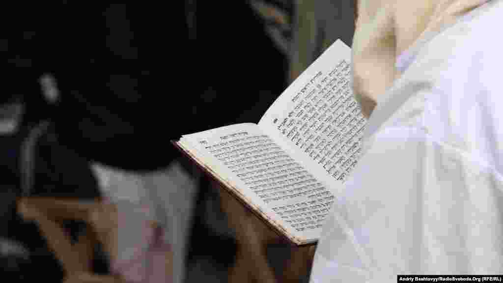 A Hasidic Jew reads prayers on Rosh Hashanah, the beginning of the new year. According to the Jewish calendar, the holiday marks the start of the year 5774.