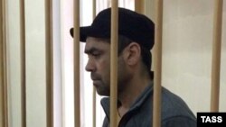 Obidzhon Dzhurabayev, suspected in recruiting people into the Hizb ut-Tahrir terrorist organization and promoting radical Islam, is seen in a Moscow court on October 20.