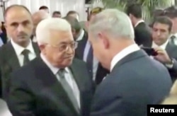 Махмуд Аббас та прем'єр-міністр Ізраїлю Біньямін Нетаньягу на церемонії поховання Шимона Переса. Єрусалим, 30 вересня 2016 року