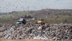 Crows fly above the massive state owned landfill of Mirash in Kosovo.