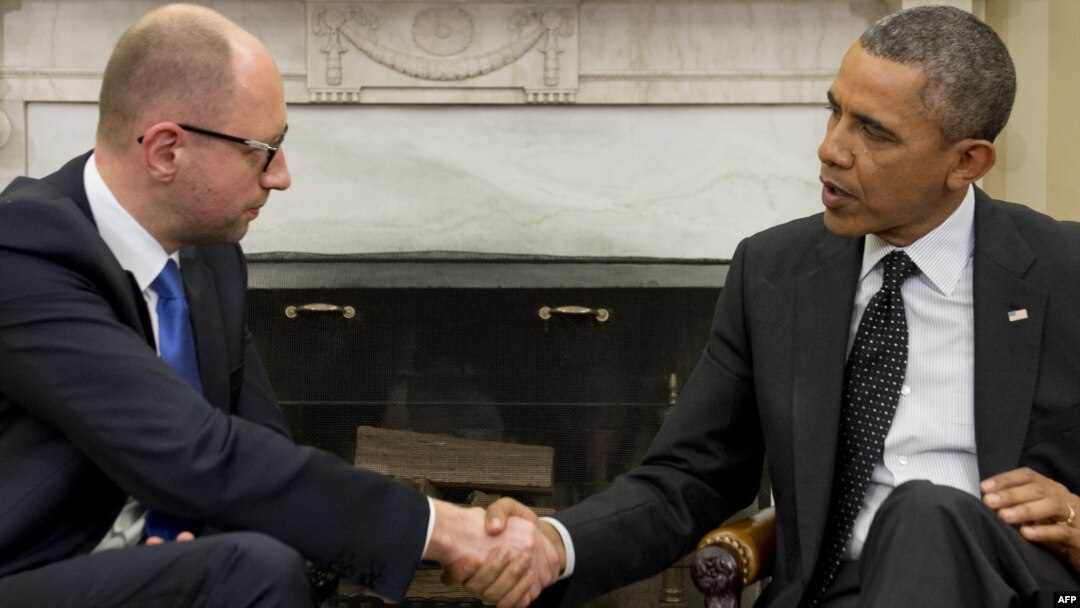 US President Barack Obama (right) shakes hands with Ukrainian Prime Minister Arseniy Yatsenyuk during meetings in the Oval Office of the White House in Washington, D.C. on March 12.