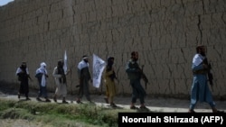 FILE: Afghan Taliban fighters in eastern Afghanistan.