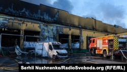 A fire broke out in a warehouse after a Russian rocket attack in the Bucha District near Kyiv on  August 1.