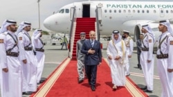 Pakistani Prime Minister Shehbaz Sharif (center) walks with Qatari minister of state for foreign affairs, Sultan bin Saad Al Muraikhi upon the latter's arrival in Doha on April 16 as part of a four-day tour before a possible second round of US-Iran peace talks. 