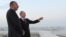 Azerbaijan -- Russia's President Vladimir Putin (L) and his Azerbaijani counterpart Ilham Aliyev (R) speak as they walk in Baku, on August 13, 2013. 